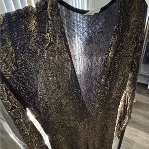 ￼ women’s gold glittery jumpsuit size l
